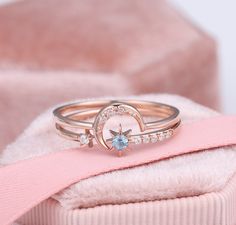 Moon And Star Ring, Crescent Star Ring, Sun Moon Stars Ring, Blue Topaz Gemstone, 2 Piece Ring Set, Diamond Bridal Ring Set, Birthstone Ring ✧･ﾟ: *✧･ﾟ:* Welcome to Charles Davin Jewelry*:･ﾟ･ﾟ✧ Moissanite - a gemstone known to bring in luck in someone's life, the user can give off a look of elegance. You can give your special someone luck whilst showing your love to them. Ring 1 (Moon): ✶Material: 10K/ 14K/ 18K ✶Main Stone: Moissanite ✶Side Stone: - ✶Color: D Colorless ✶Clarity: VVS1 ✶Cut: Excell Star And Moon Rings, Blue Star Ring, Space Engagement Ring, Star Engagement Ring, Stars Ring, Diamond Bridal Ring Sets, Moon And Star Ring, Freshwater Pearl Ring, Art Deco Diamond Rings