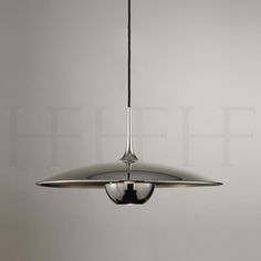 a modern light fixture hanging from the ceiling