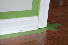 the corner of a door with tape on it