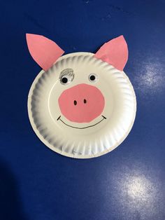 a paper plate with a pig face on it