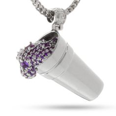 Texas tea, lean, syrup, and purple jelly have all been used to describe this popular drink. Now you can rep the famous concoction with this Purple Drank Necklace. The Purple Drank necklace provides a 3D image of a styrofoam cup, fitted with purple CZ stones spewing some syrup. Fitted within a Greek-key bale, this piece provides the perfect representation of your favorite drink. Ice Jewelry, Texas Tea, Streetwear Jewelry, Bling Fashion, Jewelry King, 3d Image, Gold Cup, Silver Plated Jewelry, Hip Hop Jewelry