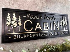 a sign on the wall that says nanna & papa's cabin buckhorn lake