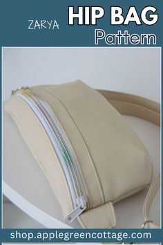 a white purse with zippers on it and the words hip bag pattern above it