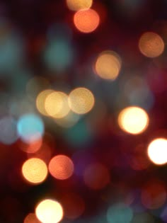 blurry image of colorful lights in the night sky with bokeh effect on them