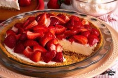 a cheesecake with strawberries is on a plate