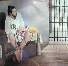 a painting of a man sitting on a bench in front of a jail cell door