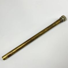 an old brass pipe on a white background