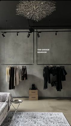 an open room with clothes hanging on the wall