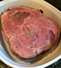 a large piece of meat in a white bowl