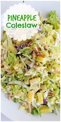 a white plate topped with a salad covered in lettuce and pineapples