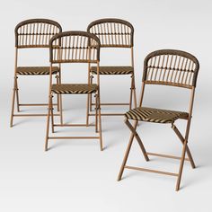 set of four bamboo folding chairs with rattan seats