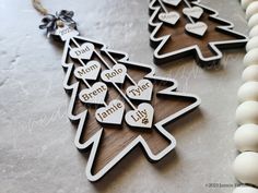 two wooden christmas ornaments with words on them