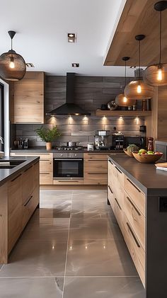 a large kitchen with wooden cabinets and black counter tops, along with stainless steel appliances