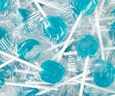 many blue lollipops are in plastic wrappers