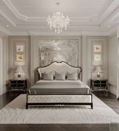 a bedroom with a large bed and chandelier