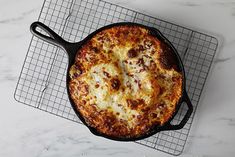 a pizza sitting on top of a wire rack