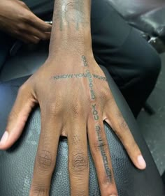 a person with a tattoo on their hand