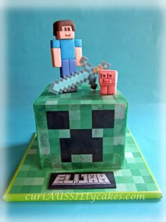 a cake made to look like an image of a minecraft character on top of a block