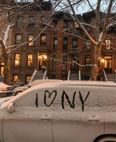 a car covered in snow with the word tony written on it