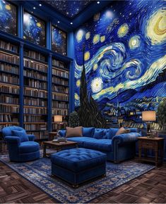 a living room filled with blue couches and bookshelves under a starry night sky mural