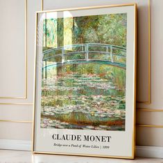 a painting on the wall with water lilies and a bridge in the background that reads claue monet