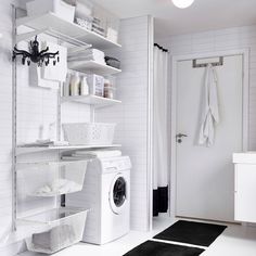 a washer and dryer in a white laundry room