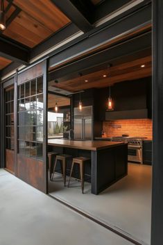 an open kitchen and dining area with sliding glass doors