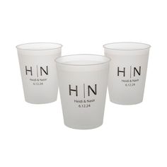 three white cups with the words hn on them