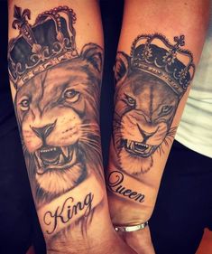 two people with tattoos on their arms that have lions and crowns on them, both holding hands