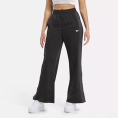 Cheer on your favorite team or just show you're part of Team Reebok in these women's high-rise pants. Inspired by old-school sportswear, these Team Pants update an original with snaps on lower part of the wide legs. The signature sheen of tricot fabric lets you know they're legit. Bottom Workout, Tricot Fabric, Fitness Trends, Cargo Joggers, High Rise Pants, Hem Style, Wide Legs, Active Women, Bottom Clothes