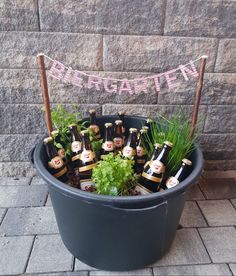 a potted plant with beer bottles in it