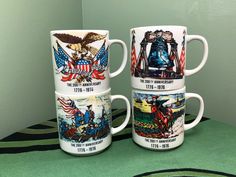 three coffee mugs with images of presidents and their families on them sitting on a table