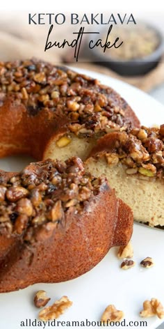 a bundt cake with walnuts and pecans on top is cut in half