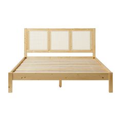 a wooden bed frame with white headboard and foot board on the bottom part of it