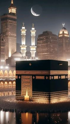 the ka'bah in front of a city at night