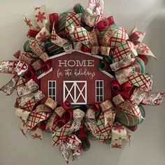 a wreath that says home for the holidays