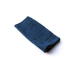 a blue tie laying on top of a white surface