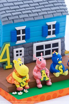 the peppa pig family is posed in front of their house with numbers on it