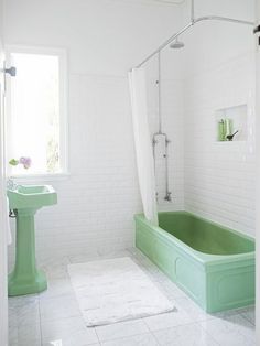 an instagram with a green bathtub and sink in it's center area