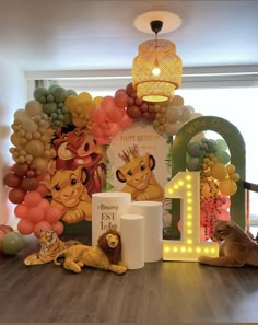 a birthday party with lion balloons and decorations