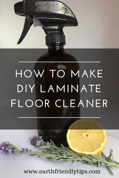 a bottle of homemade diy laminate floor cleaner next to lavender flowers and lemons