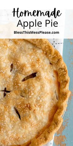 a homemade apple pie on top of a blue tablecloth with text overlay that reads homemade apple pie