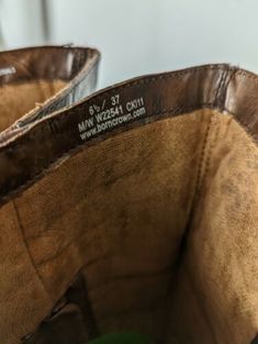 two brown leather baskets sitting next to each other