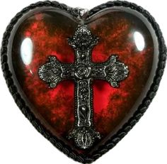 a red heart with a cross on it