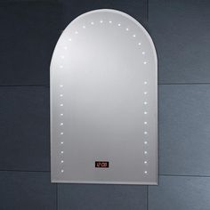 a white bathroom mirror mounted to the side of a gray wall with lights on it