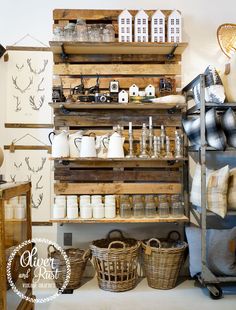 the shelves are filled with jars and other items