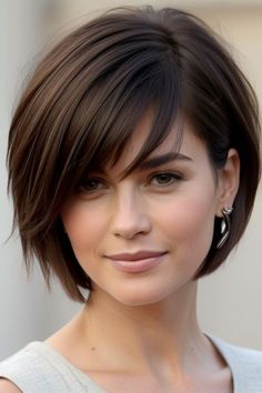 Discover the best haircut ideas for round faces for women that enhance your natural features and create a flattering silhouette. From layered cuts to textured bobs, explore a variety of styles designed to add dimension and elongate the face. Find inspiration for both short and long haircuts that balance your face shape and complement your personal style. Get expert tips on choosing the right haircut and styling techniques to achieve a polished, modern look that highlights your round face beautifully. Short Layered Bob Hairstyles Round Face, Round Layered Bob, Short Dark Hair Round Face, Chin Length Bob With Wispy Bangs, Best Haircut Round Face, Short Bob Haircut For Round Face, Short Length Haircut For Round Faces, Short Hair Styles For Heart Shaped Face