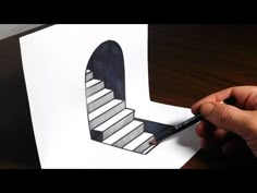 someone is drawing a stair design on paper