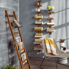 a ladder leaning up against a wall next to a chair and bookshelf filled with books