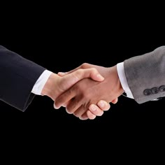 two men shaking hands with each other